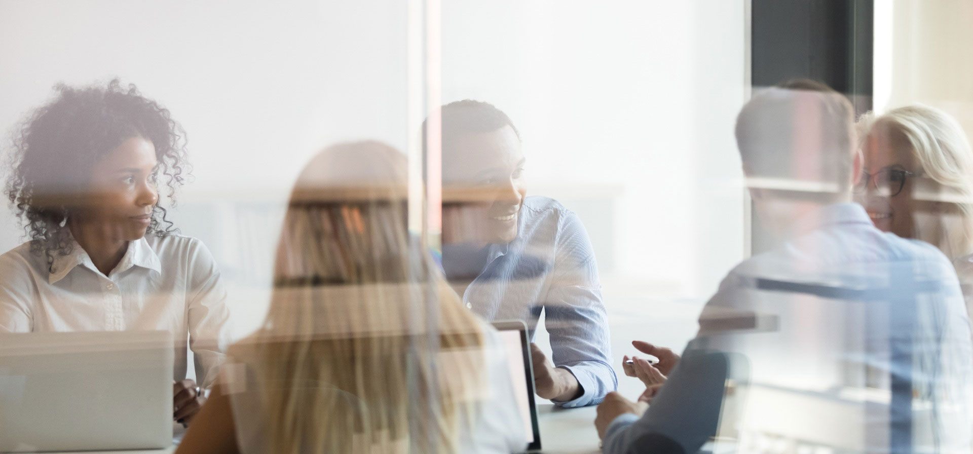 people talking at a conference table