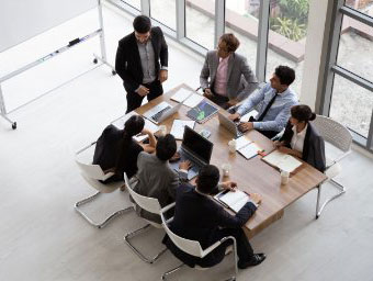 people working at a conference table